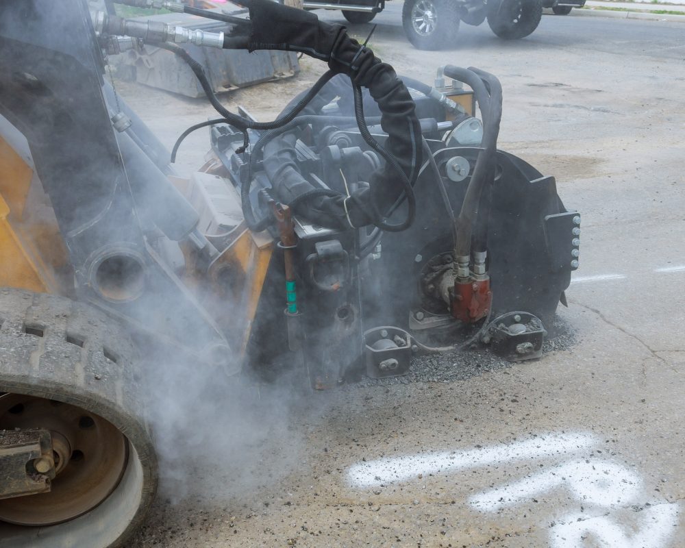 Close up of tractor with milling cutter for asphalt